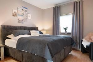 a bedroom with a large bed and a window at Ferienhaus Thomas in Colnrade