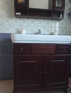 a bathroom sink with a white counter top at Villa Lukita in Cangas de Morrazo