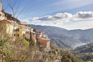 a group of buildings on the side of a mountain at Residenza del Capitano in Levanto
