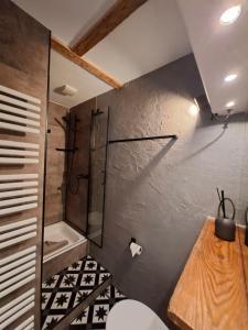 a bathroom with a shower and a toilet at Ferienwohnung Möwennest by Deju in Norderney +30 photos