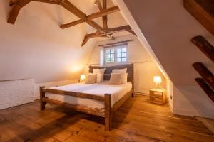 a bedroom with a bed and a window at Château des Salettes in Anoye +17 photos