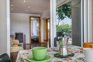 a table with a coffee maker on top of it at Olga in Platja d'Aro