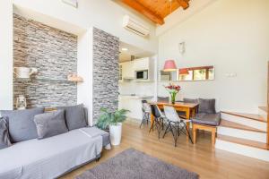 a living room with a couch and a table at Panoramico in Oden