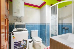 a bathroom with a toilet and a sink at Arcoiris Al Mar Playa San Marcos in San Marcos +17 photos
