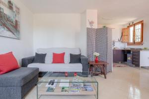 a living room with a couch and a glass table at Apartment Luna in Salobreña