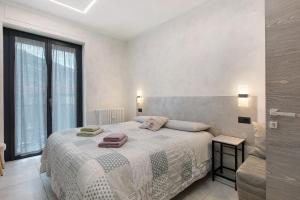 a bedroom with a bed and a large window at Double room - Myaostaproject in Aosta