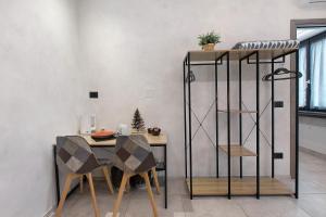 a dining room with a table and a shelf at Double room - Myaostaproject in Aosta