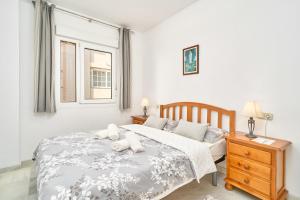 a bedroom with a bed with two pillows on it at Ferienwohnung Peñoncillo in Torrox
