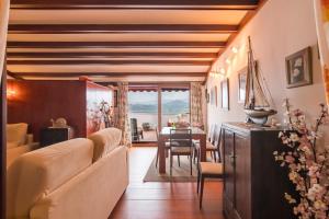 a living room with a couch and a table at Estudio La Barquera in San Vicente de la Barquera