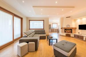 a living room with a couch and a fireplace at Passioncasa in Torri del Benaco