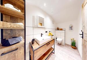 a bathroom with a sink and a toilet at Apart Hennewinkl in Oetz