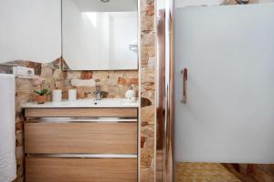 a bathroom with a sink and a mirror at El Lagar in Los Silos +14 photos