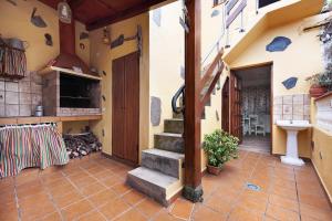 a house with a staircase and a sink in it at El Lagar in Los Silos