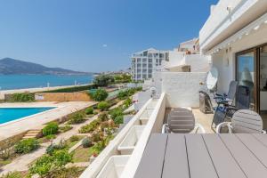 a balcony with chairs and a view of the ocean at Top first line apartment Altea in Altea