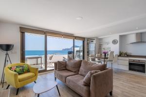 a living room with a couch and a view of the ocean at Top first line apartment Altea in Altea