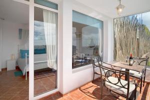 a room with a table and chairs and a dining room at Finca Fani 2 in Agüimes