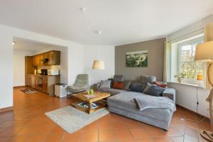 a living room with a couch and a table at Ferienwohnung Dora in Medebach