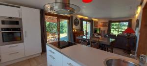 a kitchen and living room with a dining room at Morzine Panoramic in Morzine