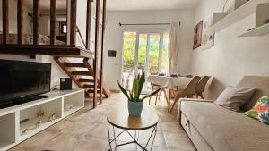 a living room with a couch and a table at In casetta in Cagliari