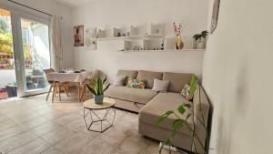 a living room with a couch and a table at In casetta in Cagliari