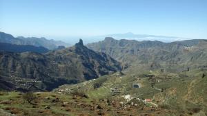 a view of a mountain range with a town on it at Chalet Rural Marian in Santa Maria de Guia de Gran Canaria