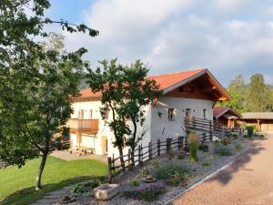 a house with a fence in front of it at Egger an der Lahn - Apt Wald in San Genesio Atesino