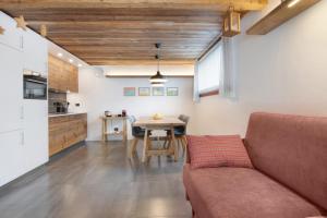 a living room with a couch and a table at Casa Nadia in Verceia