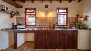 a kitchen with a sink and a counter top at Casa Margarita 4 in Mala