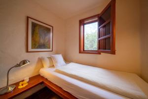 a bedroom with two beds and a window at Casa Margarita 4 in Mala +2 photos