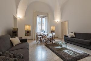 a living room with a couch and a table at Dimora Cece in Francavilla Fontana