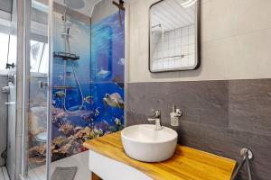 a bathroom with a sink and a shower at Casa Doro in Donaueschingen +14 photos