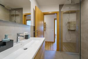 a bathroom with a sink and a shower at Brandenkopfblick in Oberharmersbach +28 photos