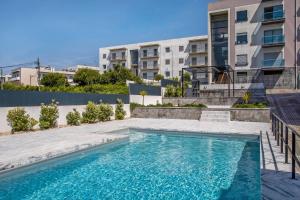 a swimming pool in front of a building at Apartment Beach Waves Home in Nazaré