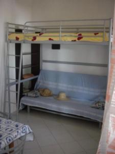 a bunk bed with two bunk beds in a room at Euroholiday Village 1G in Lido di Jesolo