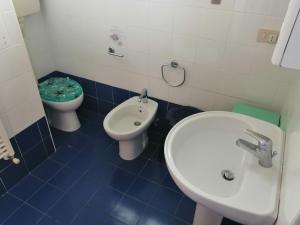 a bathroom with a toilet and a sink at Euroholiday Village 1G in Lido di Jesolo +26 photos