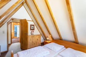 a bedroom with two beds in a attic at Ferienhaus Moritz in Siegsdorf