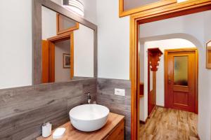 a bathroom with a sink and a mirror at Appartamento Primavera 1 in Moena +13 photos