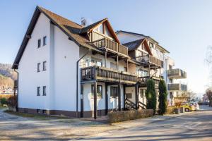 a building with balconies on the side of it at Gästehaus Noller in Bodman-Ludwigshafen