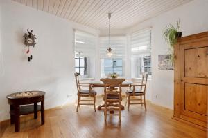 a dining room with a wooden table and chairs at Ferienwohnung Dietsche Todtnau in Todtnau
