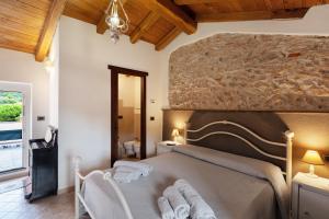 a bedroom with a large bed with towels on it at Antico Frantoio in Ceriale