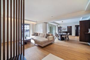 a living room with a couch and a table at Schenna Chalet - Apt Dora in Schenna
