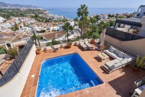 a swimming pool on top of a house at Balcon Bella Vista in Nerja