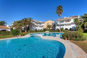 a swimming pool in front of a villa at Ducado B104 in Pals