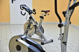 an exercise bike in a room with a gym at Residence Diana Apartment 103 in Terento