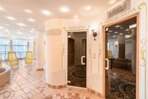 a lobby with a door leading into a room at Residence Diana Apartment 103 in Terento +17 photos