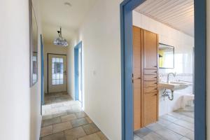 a bathroom with a sink and a mirror at Haus Halligblick in Dagebüll +128 photos