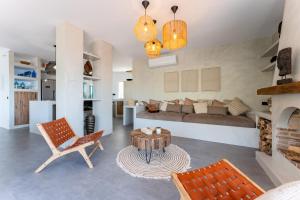 a living room with a couch and a table at Casa Rocas in Mijas +29 photos