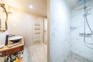 a bathroom with a sink and a shower at le chai de la lumineuse in Saint-Pierre-dʼOléron +22 photos