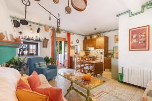 a living room with a couch and a table at La Rana Verde de Arriba in Los Romeros