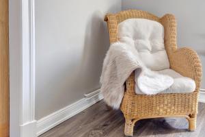 a wicker chair with a white blanket on it at Bei der alten Keksfabrik in Hamburg +17 photos